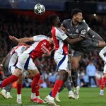 LONDON, ENGLAND - APRIL 08: Jude Bellingham of Real Madrid shoots at goal whilst under pressure from Thomas Partey of Arsenal during the UEFA Champions League 2024/25 Quarter Final First Leg match between Arsenal FC and Real Madrid C.F. at Emirates Stadium on April 08, 2025 in London, England. (Photo by Justin Setterfield/Getty Images)