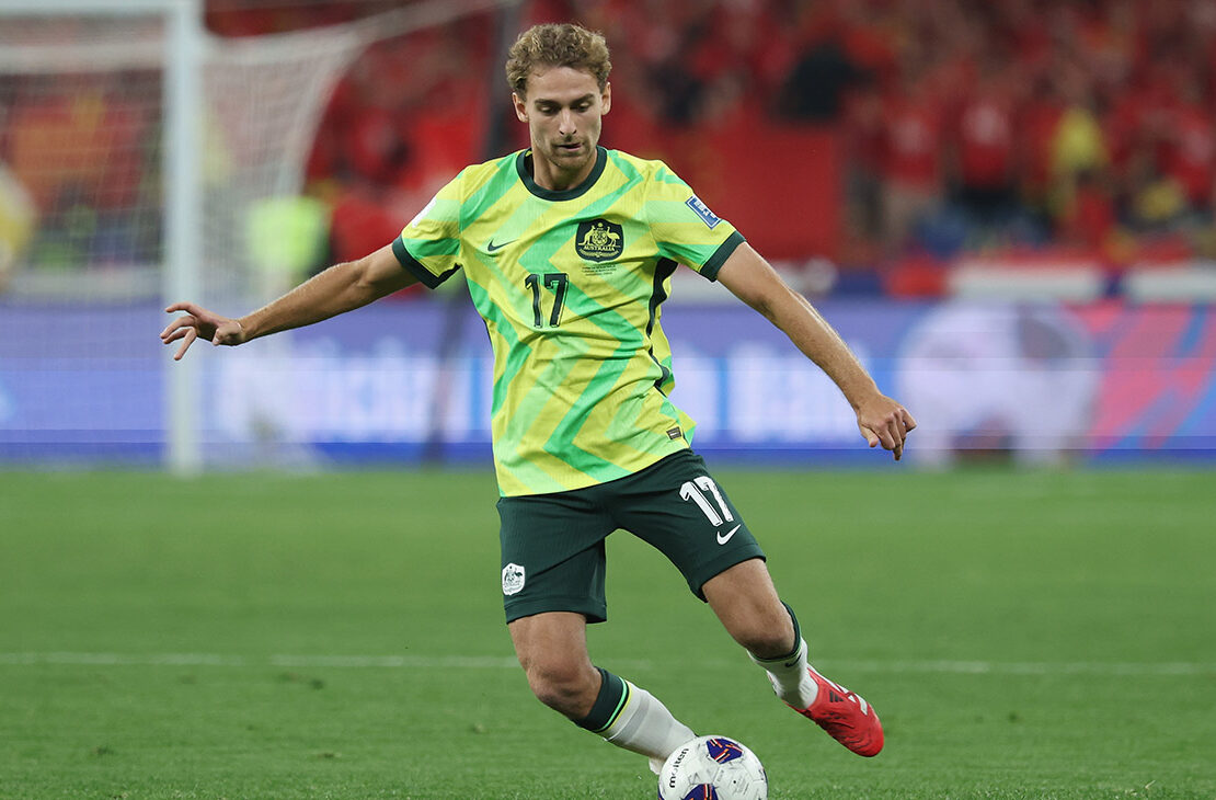 Ryan Teague of Australia competes the ball during the FIFA World Cup Asian Qualifiers Group C match between China and Australia at Hangzhou Olympic Sports Centre Stadium on March 25, 2025 in Hangzhou, China.